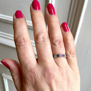 Amethyst and diamond ring shown on hand
