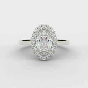 0.33ct Oval Cut Diamond Halo with Plain Shoulders Engagement Ring  Centre Diamond Weight: 0.33ct  Centre Stone Cut: Oval Cut   Diamond Weight on Halo: 0.15ct  Diamond Cut on Halo: Round Brilliant  Total Diamond Weight: 0.48ct  Note:  This ring is made to order and lead time is 6 weeks.