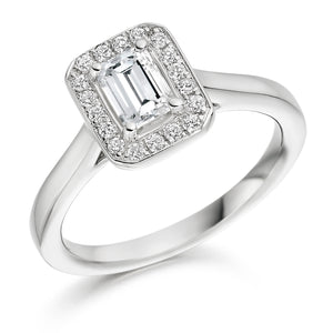 0.50ct Emerald Cut Diamond Engagement ring with a diamond halo surround and plain shoulders.  Centre Diamond Weight: 0.50ct  Centre Stone Cut: Emerald Cut  Diamond Weight on Halo: 0.15ct  Diamond Cut on Halo: Round Brilliant Cut  Total Diamond Weight: 0.65ct  Available in Yellow Gold, Rose Gold, White Gold and Platinum.  This ring is also available with Lab Grown Diamonds - contact us for further information.