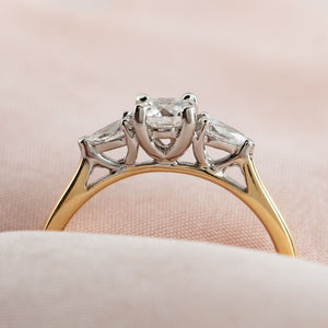 side profile of three stone diamond engagement ring