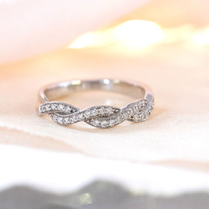 Diamond crossover eternity ring
