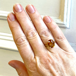 Citrine dress ring shown on hand