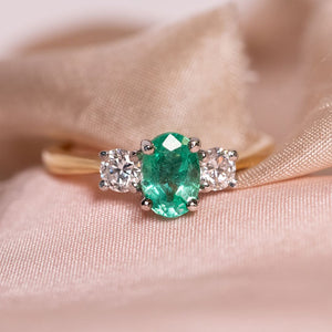 Oval emerald and diamond ring
