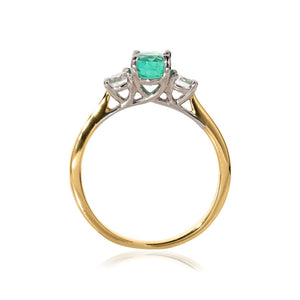 Side view of emerald and diamond ring