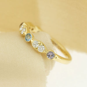 Heirloom birthstone ring with aquamarine, diamonds and tanzanite