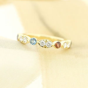 Birthstone ring with aquamarine, diamonds and garnet