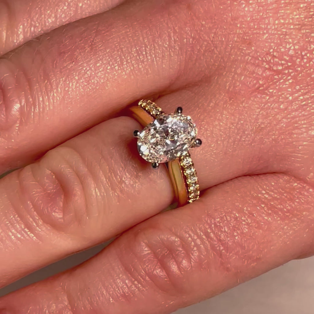 Oval Diamond Engagement ring with Diamond Wedding Band shown on hand