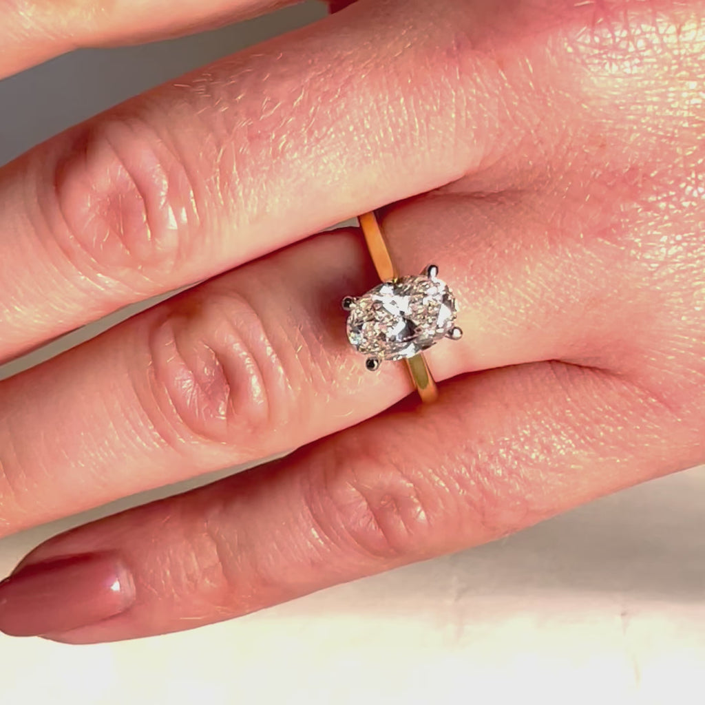 Oval Diamond Engagement Ring on hand