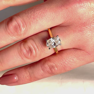 Oval Diamond Engagement Ring on hand