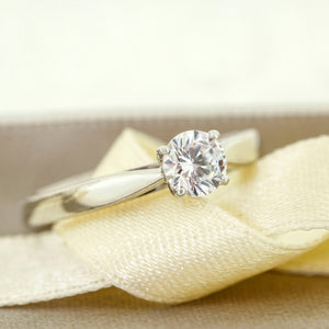 1.00ct Round Centre Stone.  Solitaire diamond ring in a four claw setting. 