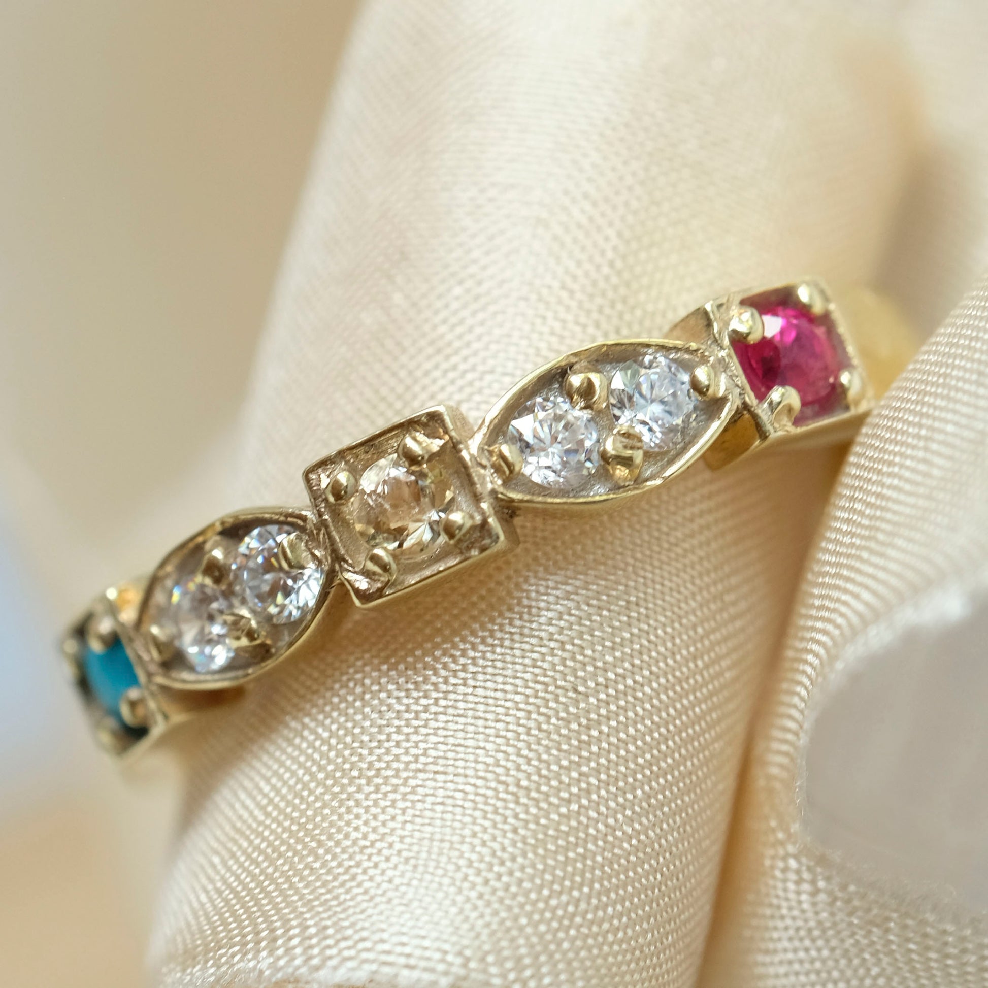 3 birthstone heirloom ring showing topaz