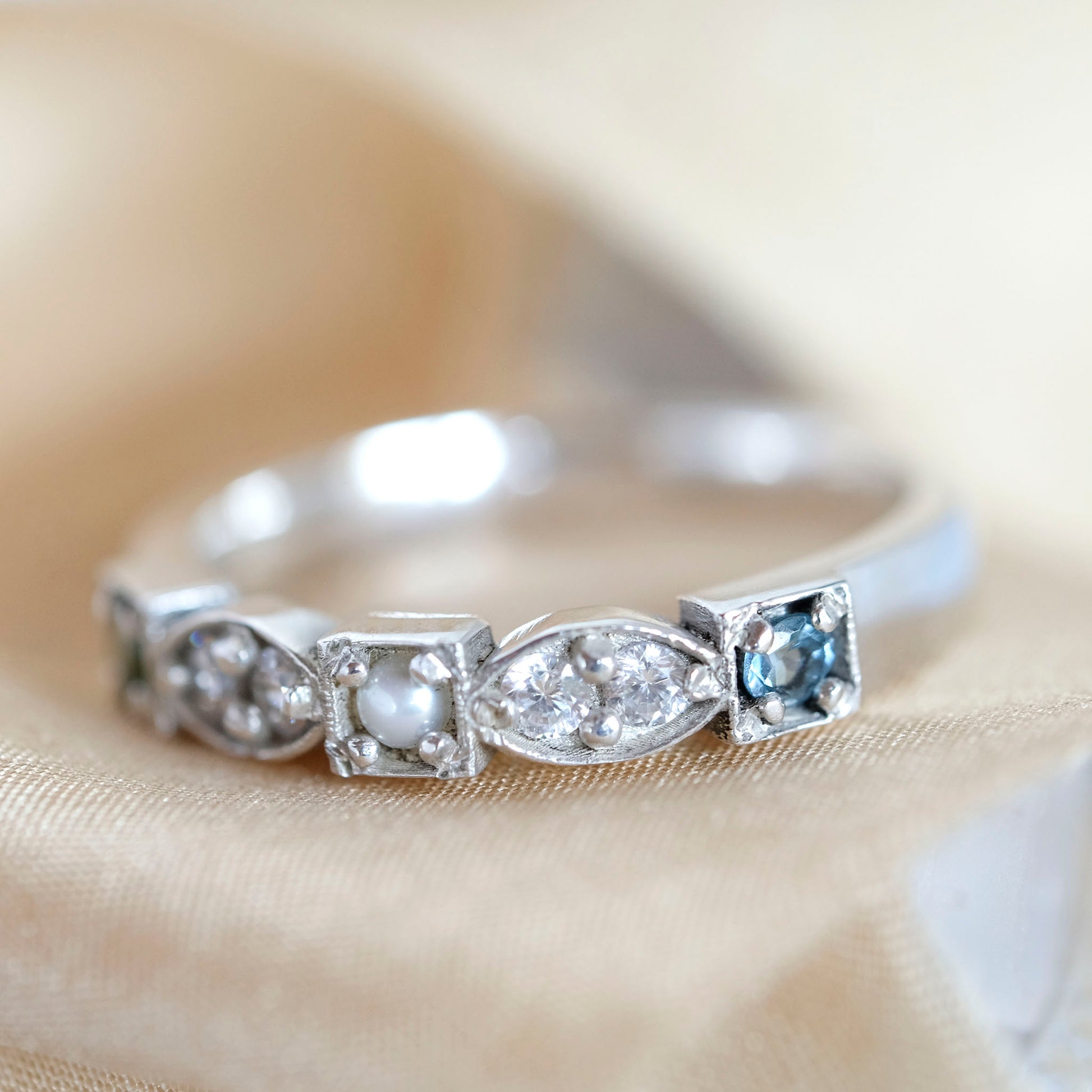 Heirloom ring with diamonds and three different birthstones
