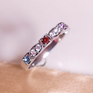 4 birthstone heirloom ring showing aquamarine and ruby