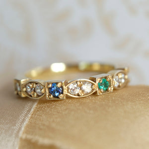 4 birthstone heirloom ring showing diamonds, sapphire and emerald