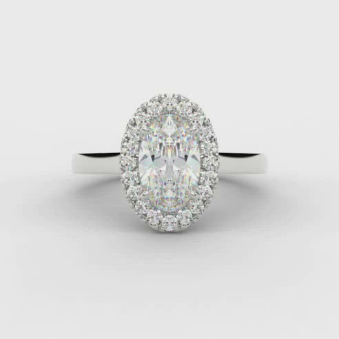 0.33ct Oval Cut Diamond Halo with Plain Shoulders Engagement Ring  Centre Diamond Weight: 0.33ct  Centre Stone Cut: Oval Cut   Diamond Weight on Halo: 0.15ct  Diamond Cut on Halo: Round Brilliant  Total Diamond Weight: 0.48ct  Note:  This ring is made to order and lead time is 6 weeks.