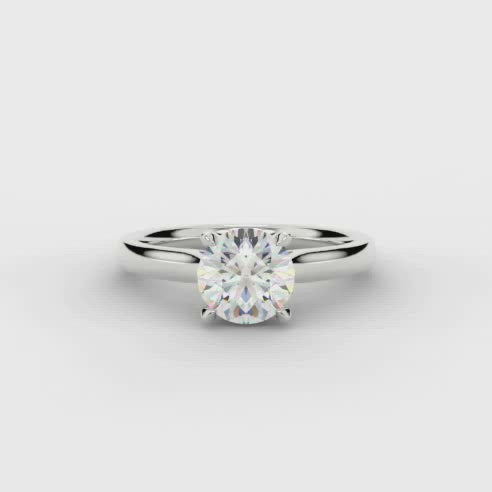 This Solitaire Engagement Ring has a 0.33ct Round Brilliant Cut centre diamond in a four claw setting with plain shoulders