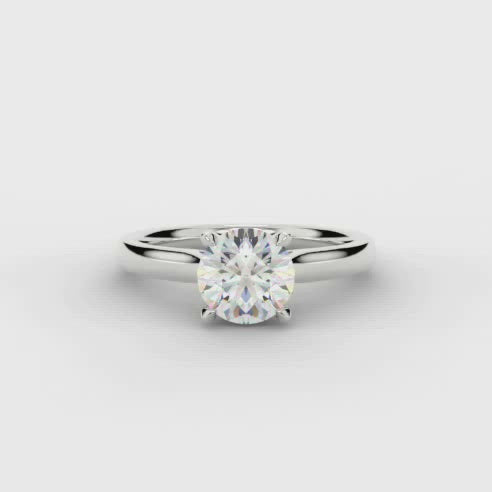This Solitaire Engagement Ring has a 0.33ct Round Brilliant Cut centre diamond in a four claw setting with plain shoulders