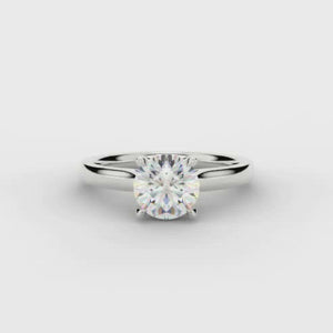 This Solitaire Engagement Ring has a 0.33ct Round Brilliant Cut centre diamond in a four claw setting with plain shoulders