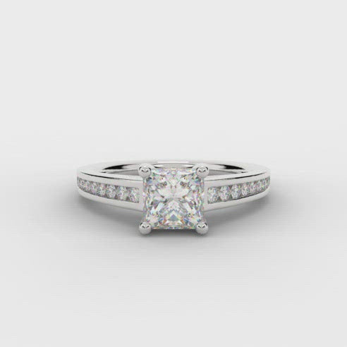 Princess cut diamond solitaire engagement ring with diamond set shoulders