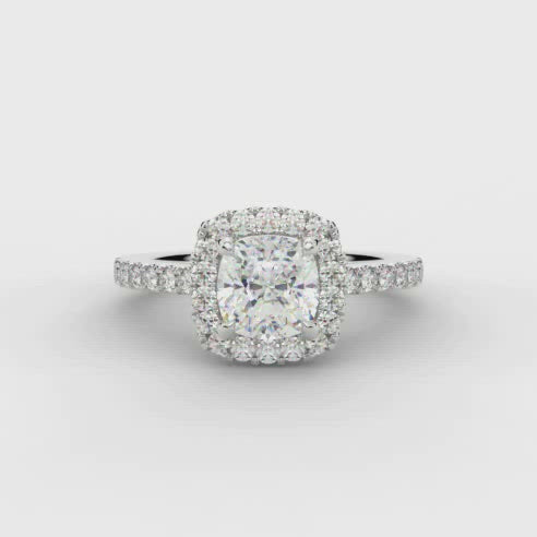 0.70ct Cushion Cut Diamond Engagement ring with Halo and Diamond set Shoulders  Centre Diamond Weight: 0.75ct  Centre Stone Cut: Cushion Cut  Diamond Cut on Shoulders: Round Brilliant Cut  Diamond Weight on Halo/Shoulders: 0.40ct  Total Diamond Weight: 1.15ct  This ring is also available with Lab Grown Diamonds - contact us for further information.