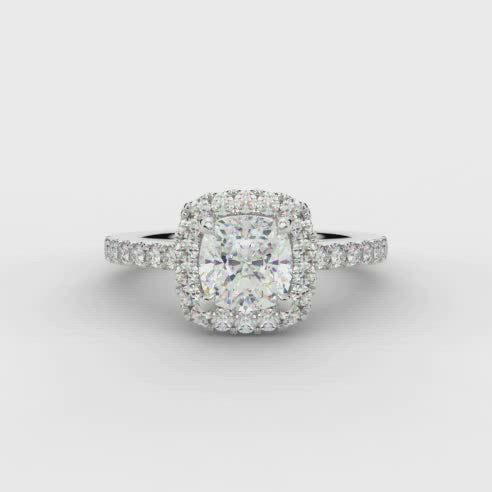 0.70ct Cushion Cut Diamond Engagement ring with Halo and Diamond set Shoulders  Centre Diamond Weight: 0.75ct  Centre Stone Cut: Cushion Cut  Diamond Cut on Shoulders: Round Brilliant Cut  Diamond Weight on Halo/Shoulders: 0.40ct  Total Diamond Weight: 1.15ct  This ring is also available with Lab Grown Diamonds - contact us for further information.