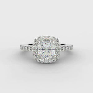 0.70ct Cushion Cut Diamond Engagement ring with Halo and Diamond set Shoulders  Centre Diamond Weight: 0.75ct  Centre Stone Cut: Cushion Cut  Diamond Cut on Shoulders: Round Brilliant Cut  Diamond Weight on Halo/Shoulders: 0.40ct  Total Diamond Weight: 1.15ct  This ring is also available with Lab Grown Diamonds - contact us for further information.