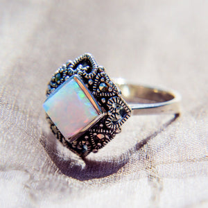 Art Deco style ring with an opal at the centre