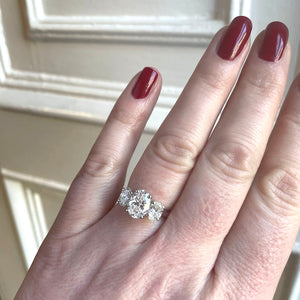 3 stone oval diamond ring shown on hand