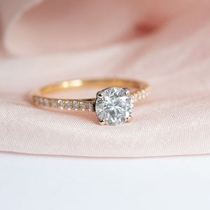 18ct Gold Solitaire Diamond Ring with Diamond Set Shoulders.