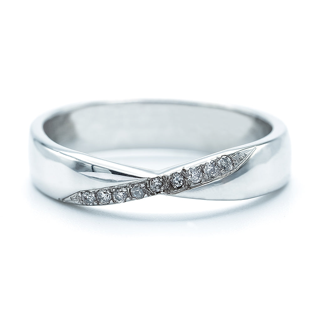 An 18ct white gold diamond ring with a twist design, featuring multiple diamonds set along the band on a white background.