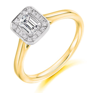 0.33ct Emerald Cut Diamond in a Diamond Halo Setting with Plain Shoulders   Centre Diamond Weight: 0.33ct  Centre Stone Cut: Emerald Cut  Diamond Weight on Halo: 0.10ct  Diamond Cut on Halo: Round Brilliant Cut  Total Diamond Weight: 0.43ct   Available in Yellow Gold, Rose Gold, White Gold and Platinum.