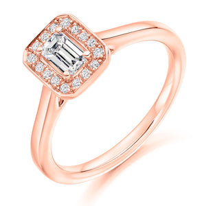 0.33ct Emerald Cut Diamond in a Diamond Halo Setting with Plain Shoulders   Centre Diamond Weight: 0.33ct  Centre Stone Cut: Emerald Cut  Diamond Weight on Halo: 0.10ct  Diamond Cut on Halo: Round Brilliant Cut  Total Diamond Weight: 0.43ct   Available in Yellow Gold, Rose Gold, White Gold and Platinum.