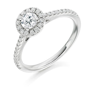 0.33ct Round Brilliant Cut Diamond Halo Engagement ring with Diamond Set Shoulders  Centre Stone: 0.33ct  Centre Stone Cut: Round Brilliant Cut  Diamond Weight on Halo/Shoulders: 0.30ct  Total Diamond Weight: 0.63ct  Note:  This ring is made to order and lead time is 6 weeks.  This ring is also available with Lab Grown Diamonds - contact us for further information.