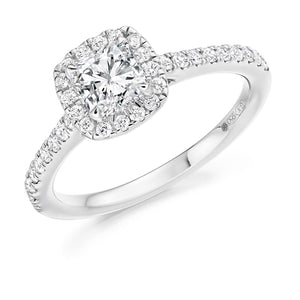 0.70ct Cushion Cut Diamond Engagement ring with Halo and Diamond set Shoulders  Centre Diamond Weight: 0.75ct  Centre Stone Cut: Cushion Cut  Diamond Cut on Shoulders: Round Brilliant Cut  Diamond Weight on Halo/Shoulders: 0.40ct  Total Diamond Weight: 1.15ct  This ring is also available with Lab Grown Diamonds - contact us for further information.