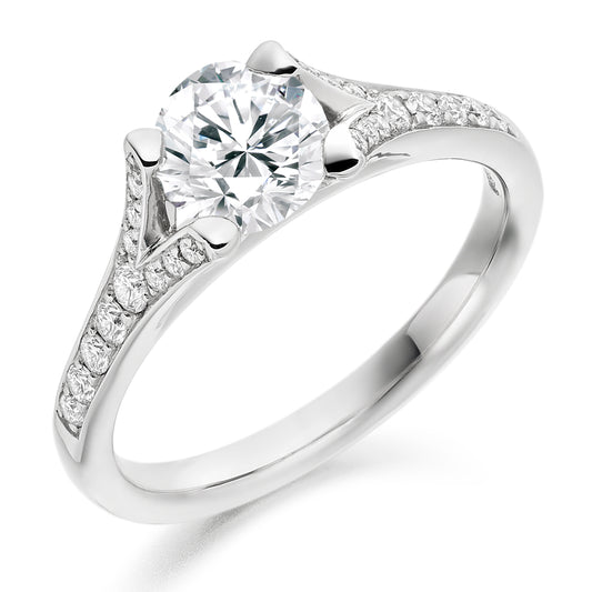 0.50ct Diamond Solitaire Engagement Ring with Split Diamond Set Shoulders  Centre Diamond Weight: 0.50ct  Centre Stone Cut: Round Brilliant  Diamond Weight on Shoulders: 0.20ct  Total Diamond Weight: 0.70ct