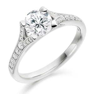 0.50ct Diamond Solitaire Engagement Ring with Split Diamond Set Shoulders  Centre Diamond Weight: 0.50ct  Centre Stone Cut: Round Brilliant  Diamond Weight on Shoulders: 0.20ct  Total Diamond Weight: 0.70ct