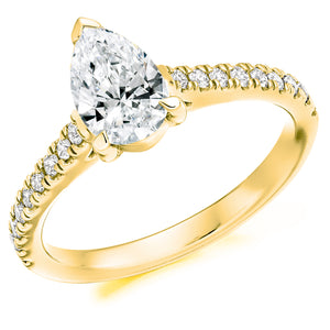 This Solitaire Engagement Ring has a 0.75ct Pear Cut centre diamond in a four claw setting. It is beautifully accented by round brilliant cut diamonds on the band in a micro claw setting totalling 0.25ct  This gives total diamond weight of 1.00ct. 