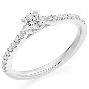 0.33ct Round Brilliant Cut Solitaire With Micro Claw Diamond Set Shoulders Engagement Ring.  Centre Diamond Weight: 0.33ct  Centre Stone Cut: Round Brilliant  Diamond Weight on Shoulders: 0.20ct  Diamond Cut on Shoulders: Round Brilliant  Total Diamond Weight: 0.53ct  This ring is also available with Lab Grown Diamonds - contact us for further information.