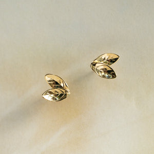 Gold double leaf shaped stud earrings
