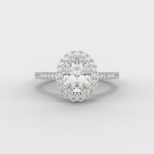 0.40ct Oval Cut Diamond Halo Surround Engagement Ring with Diamond Shoulders  Centre Diamond Weight: 0.40ct  Centre Stone Cut: Oval Cut  Diamond Weight on Halo/Shoulders: 0.35ct  Total Diamond Weight: 0.75ct  This ring is also available with Lab Grown Diamonds - contact us for further information.  Note:  This ring is made to order and lead time is 6 weeks.