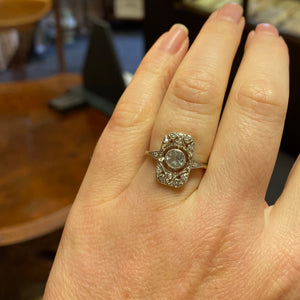 Art Deco style aquamarine ring shown on a hand