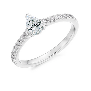 0.33ct Pear Cut Solitaire with Diamond Set Shoulders  This Solitaire Engagement Ring has a 0.33ct Pear Cut centre diamond in a four claw setting.  It is beautifully accented by round brilliant cut diamonds on the band in a micro claw setting totalling 0.20ct   This gives total diamond weight of 0.53ct. 